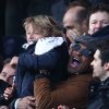 Yannick Noah et son fils Joalukas lors de la victoire du PSG face à Evian Thonon Gaillard au Parc des Princes à Paris le 18 janvier 2015