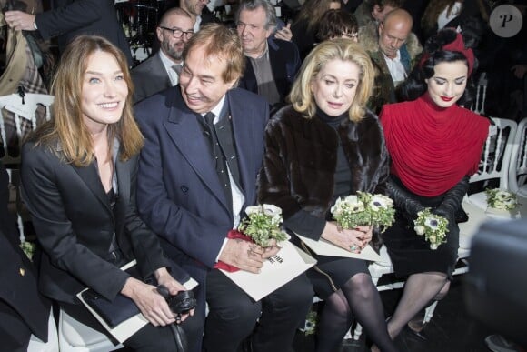 Carla Bruni-Sarkozy, Gilles Dufour, Catherine Deneuve et Dita von Teese - Personnalités au défilé de mode Jean Paul Gaultier, collection Haute Couture printemps-été 2015 à Paris le 28 janvier 2015.