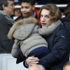 Jean Sarkozy et son fils Solal lors du match entre le Paris Saint-Germain et Caen au Parc des Princes à Paris, le 14 février 2015