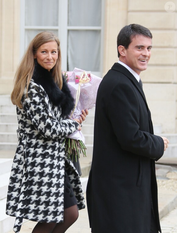 Anne Gravoin et Manuel Valls à la sortie du Pplais de l'Elysée à Paris le 22 octobre 2014