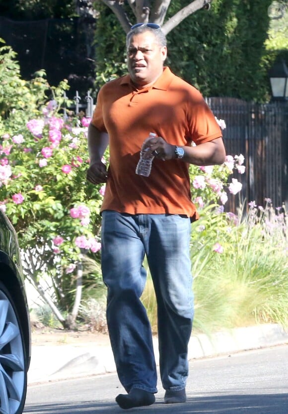 Exclusif - Laurence Fishburne se rend chez Harold Perrineau Jr. pour lui montrer sa nouvelle voiture a West Hollywood, le 25 aout 2013. 