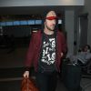 Ryan Gosling arrive à l'aéroport LAX de Los Angeles le 4 avril 2015.