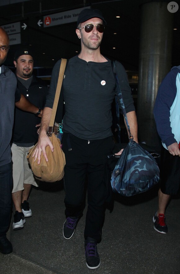 Chris Martin arrive à LAX, Los Angeles, le 13 décembre 2014