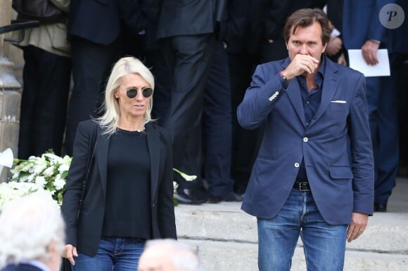 Marie-Sara et son mari Christophe Lambert - Sorties des obsèques de Patrice Dominguez en la basilique Sainte Clotilde à Paris. Le 16 avril 2015