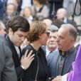  Cendrine Dominguez avec son fils L&eacute;o, Jean-Louis Borloo, le fr&egrave;re de Patrice Dominguez - Sorties des obs&egrave;ques de Patrice Dominguez en la basilique Sainte Clotilde &agrave; Paris. Le 16 avril 2015&nbsp; 