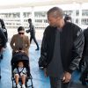 Kim Kardashian, Kanye West et leur fille North West à l'aéroport de Roissy CDG. Le 16 avril 2015.