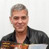 George Clooney qui tient un magazine où il est en couverture avec sa femme Amal Alamuddin Clooney - conférence de presse pour le film "Tomorrowland". Le 8 mai 2015 au Montage Hotel, à Beverly Hills.   