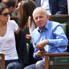 Patrick Poivre d'Arvor et une amie - People dans les tribunes lors du tournoi de tennis de Roland Garros à Paris le 29 mai 2015.