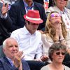 Sophie Thalmann et son mari Christophe Soumillon dans les tribunes des Internationaux de France de tennis de Roland-Garros à Paris, le 1er juin 2015.