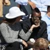 Djibril Cissé et sa compagne Marie-Cécile dans les tribunes des Internationaux de France de tennis de Roland-Garros à Paris, le 1er juin 2015.
