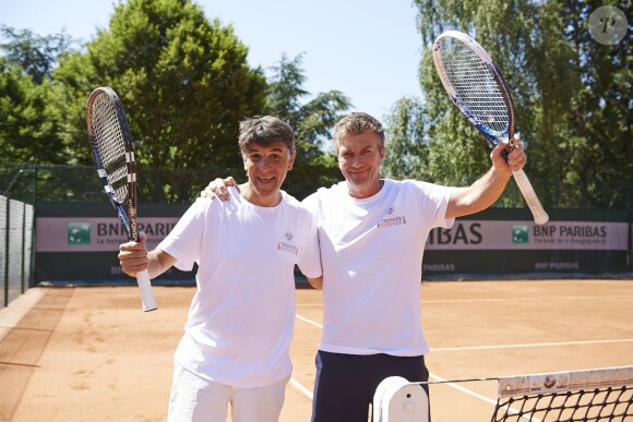 Tex et Philippe Caroit, lors de la troisième journée du Trophée des personnalités à Roland-Garros, le jeudi 4 juin 2015.