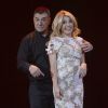 Jean-Marie Bigard et sa femme Lola lors de la célébration de ses 60 ans sur la scène du Grand Rex à Paris le 23 mai 2014.