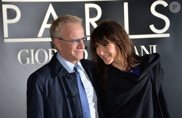 Sophie Marceau et son compagnon Christophe Lambert au Palais de Tokyo à Paris, le 21 janvier 2014.