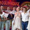 Exclusif - Marie-José Pérec entourée des artistes du Moulin Rouge et de son compagnon Sébastien Foucras à Paris le 21 juillet 2015.