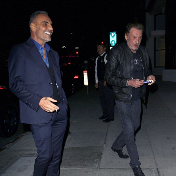 Johnny Hallyday et sa femme Laeticia sont allés dîner avec Christian Audigier et sa fiancée Nathalie Sorensen au restaurant Mr Chow à Los Angeles le 23 janvier 2015.23/01/2015 - Los Angeles