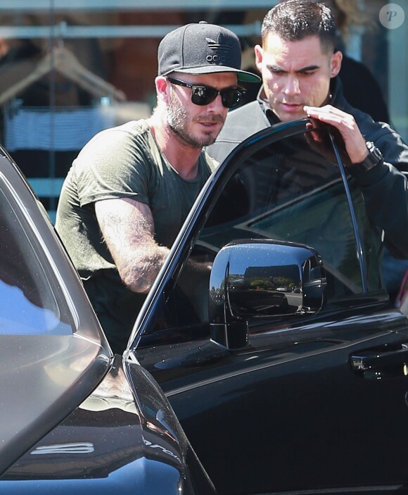 David Beckham sort de son cours de gym à Los Angeles Le 25 Juillet 2015  51808230 Soccer legend David Beckham starts his morning off with a trip to Soul Cycle gym for a workout on July 25, 2015 in Brentwood, California. David got a new tattoo of the number 99 on his hand last week to celebrate his 16th anniversary to Victoria...25/07/2015 - Los Angeles