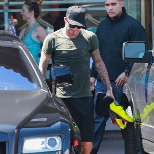 David Beckham sort de son cours de gym à Los Angeles Le 25 Juillet 2015  51808230 Soccer legend David Beckham starts his morning off with a trip to Soul Cycle gym for a workout on July 25, 2015 in Brentwood, California. David got a new tattoo of the number 99 on his hand last week to celebrate his 16th anniversary to Victoria...25/07/2015 - Los Angeles