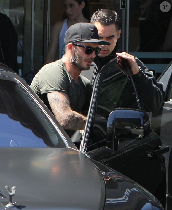 David Beckham sort de son cours de gym à Los Angeles Le 25 Juillet 2015  51808230 Soccer legend David Beckham starts his morning off with a trip to Soul Cycle gym for a workout on July 25, 2015 in Brentwood, California. David got a new tattoo of the number 99 on his hand last week to celebrate his 16th anniversary to Victoria...25/07/2015 - Los Angeles