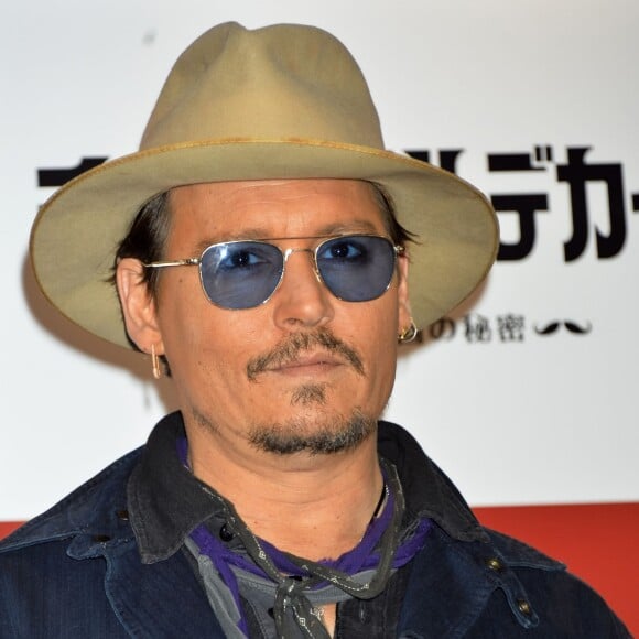 Johnny Depp pose lors du photocall du film "Charlie Mortdecai" à Tokyo, le 28 janvier 2015.