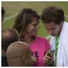 Amélie Mauresmo avec Andy Murray lors d'un entraînement au tournoi de tennis de Wimbledon à Londres le 7 juillet 2015. La championne française, alors enceinte, a accouché le 16 août 2015 de son premier enfant.