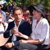 Nicolas Sarkozy avec sa femme Carla Bruni-Sarkozy participent à une rencontre avec des élus et des militants du parti Les Républicains au jardin Albert 1er à Nice le 19 juillet 2015.