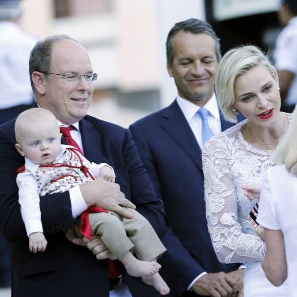 Le prince Albert de Monaco et la princesse Charlène, accompagnés de leurs enfants le prince Jacques et la princesse Gabriella, habillés en costume traditionnel, au traditionnel pique-nique de la Principauté, qui se tient chaque année au parc de la princesse Antoinette le 28 août 2015 à Monaco.