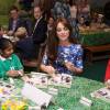Kate Middleton, duchesse de Cambridge, le prince William et le prince Harry se sont bien amusés, le 26 octobre 2015 au siège de la BAFTA, lors d'une rencontre avec des enfants dans le cadre de The Charities Forum, un événement rassemblant une trentaine d'associations qu'ils soutiennent.