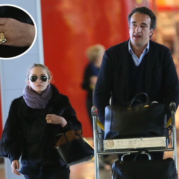 Exclusif - Mary-Kate Olsen et son fiancé Olivier Sarkozy à l'aéroport Roissy-Charles-de-Gaulle pour se rendre à New York après leur séjour à Paris, le 6 avril 2014.