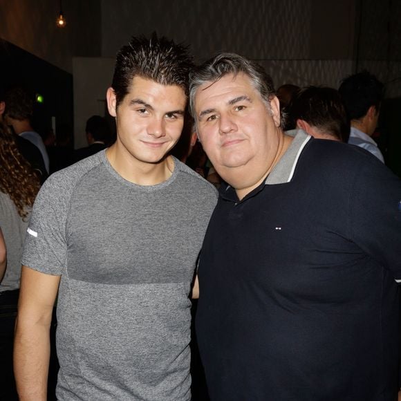 Pierre Ménès et son fils Axel lors de la soirée de lancement du jeu FIFA 2014 ) la Gaîté Lyrique à Paris, le 23 septembre 2013