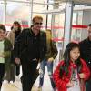 Exclusif - Anne Marcassus et sa fille Giulia, Johnny Hallyday et sa fille Jade - La famille Hallyday arrive à l'aéroport de Roissy pour prendre un vol pour aller passer leurs vacances en Thaïlande avec des amis le 19 décembre 2015
