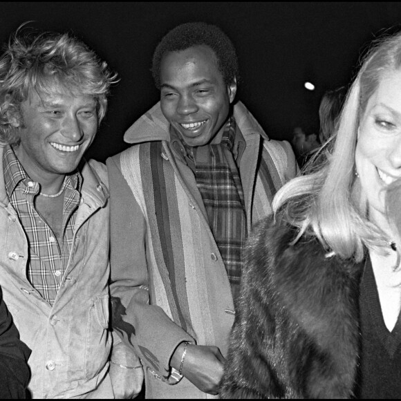 Johnny Hallyday, Alan Coriolan et Catherine Deneuve en 1980 lors d'une soirée au 78 à Paris.