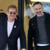 Elton John et son mari David Furnish font du shopping chez "Barney's New York" à Beverly Hills le 22 décembre 2015.