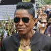 Jermaine Jackson - Les frères Jackson rendent hommage à Michael Jackson devant une photo de 1977 du chanteur du photographe Claude Vanheye installée au Gustav Mahlersquare à Amsterdam, le 30 juillet 2014. Le panneau a été inauguré le 25 juin dernier à l'occasion du 5ème anniversaire de la mort de Michael Jackson. Les fans pourront s'y recueillir jusqu'au mois d'août. Les frères Jackson ont ensuite donné un concert au Paradiso concert hall.