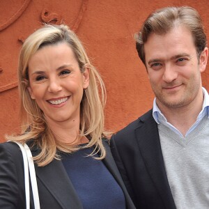 Laurence Ferrari et son mari Renaud Capuçon posant au village des Internationaux de France de tennis de Roland Garros à Paris, le 3 juin 2014.