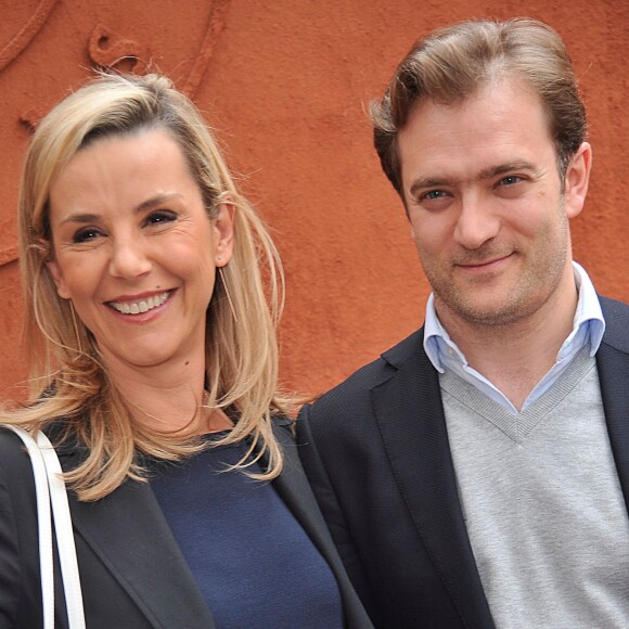 Laurence Ferrari et son mari Renaud Capuçon posant au village des Internationaux de France de tennis de Roland Garros à Paris, le 3 juin 2014.