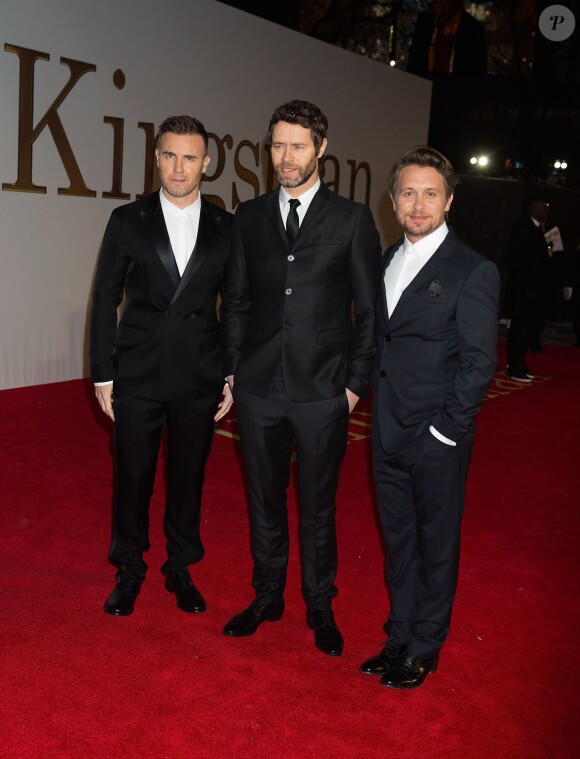 Gary Barlow, Howard Donald, Mark Owen du groupe Take That à l'Avant-première mondiale du film "Kingsman : Services secrets" à Londres, le 14 janvier 2015.