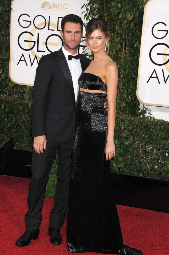 Adam Levine et sa femme Behati Prinsloo aux 72e Golden Globe Awards à Beverly Hills le 11 janvier 2015. Le couple attend pour l'automne 2016 son premier enfant.