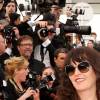 Le chanteur Christophe et sa compagne Audrey pendant la Montée des marches du film "La Tête Haute" pour l'ouverture du 68 ème Festival du film de Cannes à Cannes le 13 mai 2015