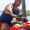 Dwayne Johnson (The Rock) sur un quad pour une scène du film "Baywatch" à Savannah le 30 mars 2016.