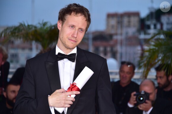 László Nemes (Grand Prix pour le film "Saul Fia" (Le Fils de Saul)) - Photocall de la remise des palmes du 68e Festival du film de Cannes, à Cannes le 24 mai 2014.