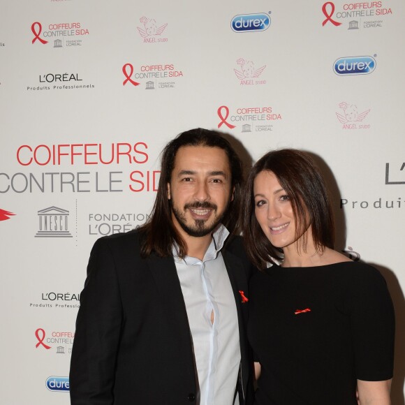 Archives - Moundir et sa femme Inès lors de l'opération " Coiffeurs Contre le Sida " édition 2014 à l'Académie L'Oréal Produits Professionnels à Paris, le 1er décembre 2014.