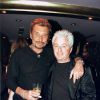 Johnny Hallyday et Cerrone lors d'une soirée organisée au Vip Paris le 15 janvier 1999