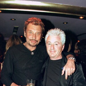 Johnny Hallyday et Cerrone lors d'une soirée organisée au Vip Paris le 15 janvier 1999