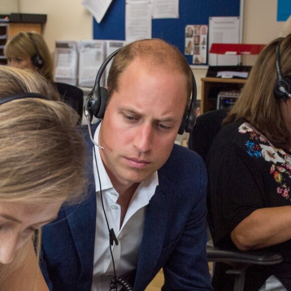 Le prince William et sa femme Kate Middleton visitent un centre d'assistance caritatif à Londres le 25 août 2016.