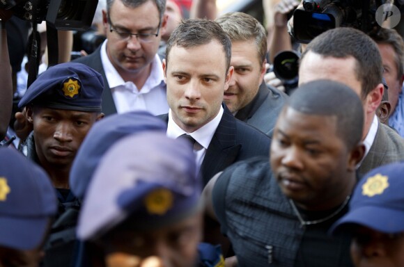 Oscar Pistorius arrive au tribunal de Pretoria pour entendre le verdict final, suite au meurtre de sa compagne Reeva Steenkamp, le 12 septembre 2014.