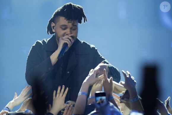 The Weeknd sur la scène du Scotiabank Saddledome, pendant les 2016 Juno Awards à Calgary, Canada, le 3 avril 2016. The Weeknd performs on stage during the 2016 Juno Awards held at Scotiabank Saddledome in Calgary, April 3rd 2016.03/04/2016 - Calgary