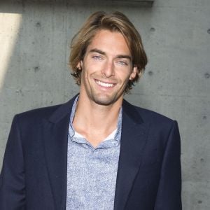 Camille Lacourt au defile de mode Giorgio Armani, collection printemps-ete 2014, lors de la fashion week de Milan. Le 23 septembre 2013