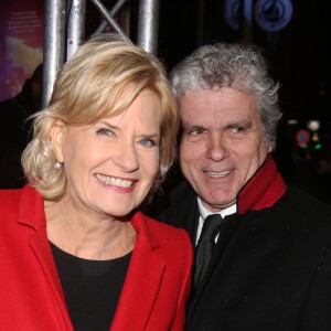 Catherine Ceylac et son mari Claude Serillon arrivent à l'avant-première du film 'The Monuments men' à l'UGC Normandie sur les Champs-Elysées à Paris le 12 Février 2014.