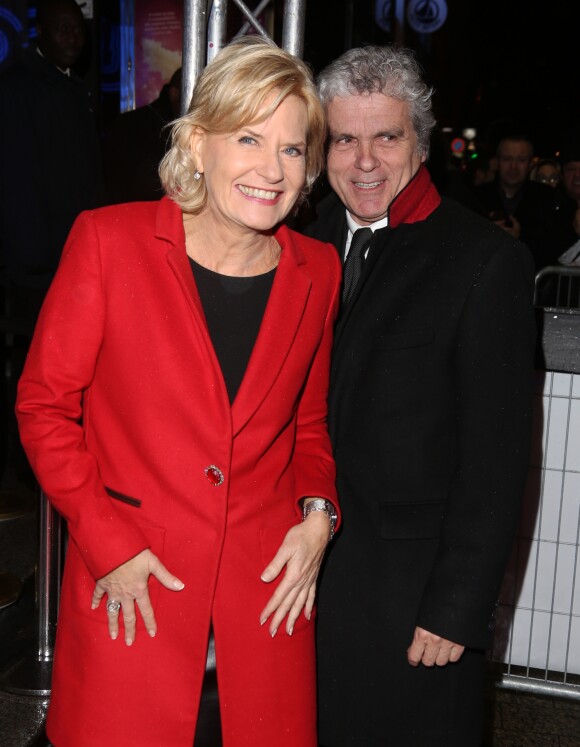 Catherine Ceylac et son mari Claude Serillon arrivent à l'avant-première du film 'The Monuments men' à l'UGC Normandie sur les Champs-Elysées à Paris le 12 Février 2014.