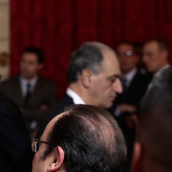 Nikola Karabatic, son fils Alek et François Hollande, président de la République lors de la réception de l'équipe des France de Handball, championne du monde, au palais de l'Elysée à Paris, le 30 janvier 2017, au lendemain de sa victoire en finale de la coupe du monde contre l'équipe de la Norvège.